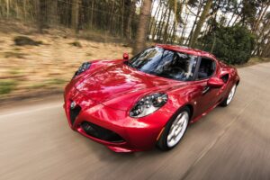 a red sportscar driving fast with Auto Insurance in Chilhowie, Bristol, VA, Wytheville, Abingdon, Glade Spring, Marion, VA