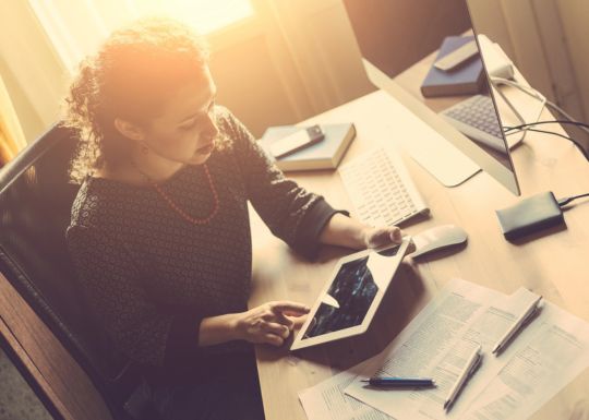 Business Owner in Wytheville, VA Reviewing a Small Business Cyber Liability Insurance Policy