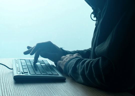 Computer hacker attempting to access a network in Bristol, VA with Small Business Cyber Insurance
